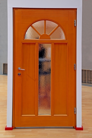 Retro brown wooden home interior door with glass detailsの写真素材