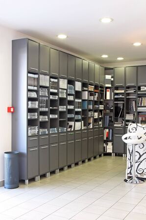 Modern office cabinet full of catalogues and peperworkの写真素材