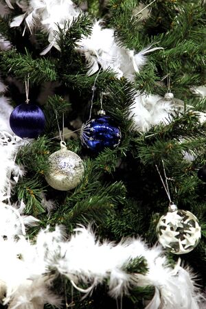 Detail of Christmas tree with blue and white ornamentsの写真素材