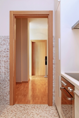 Wooden entrance frame to contemporary kitchen interiorの写真素材