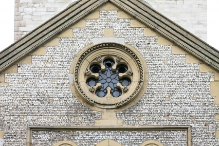 Detail of old medieval church facade with oval windowの写真素材