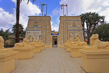 Long alley entrance to ancient Egyptian temple with sphinx rowsの写真素材