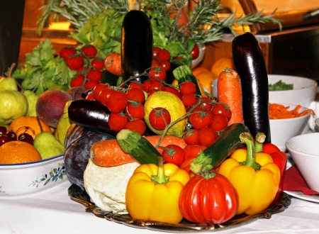 Tastefully arranged fresh vegetable plate on tableの写真素材
