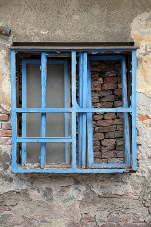 Grunge old window derelict on aged houseの写真素材
