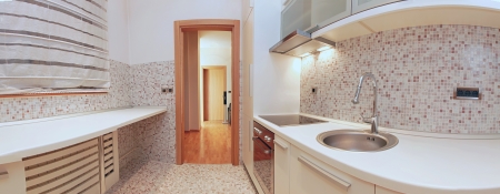 Panoramic image of modern kitchen interior with beige tilesの写真素材