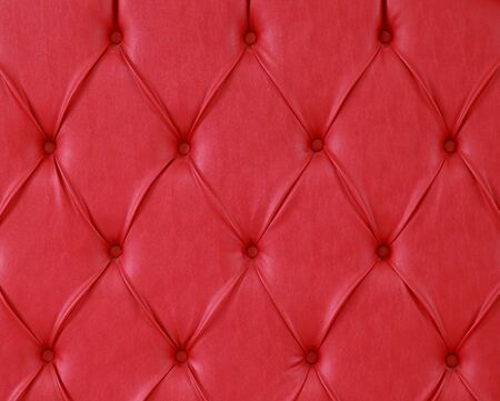 Detailed texture of red leather upholstery patternの写真素材
