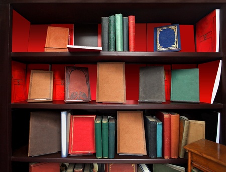 Wooden bookshelf with many old vintage booksの写真素材