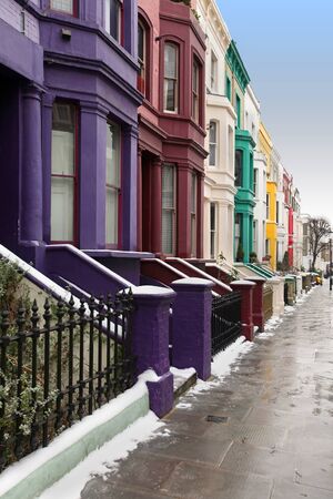 London street with colorful houses during winter dayの写真素材