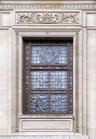 Glass window on old building with stone facadeの写真素材