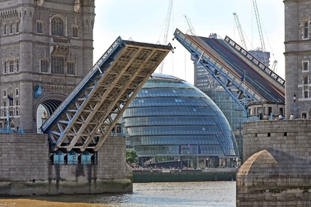 Tower bridge in London raised span to allow tall ships to pass throughの写真素材