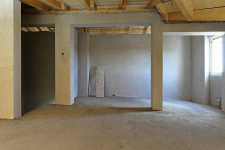 Empty unfinished house interior during construction worksの写真素材