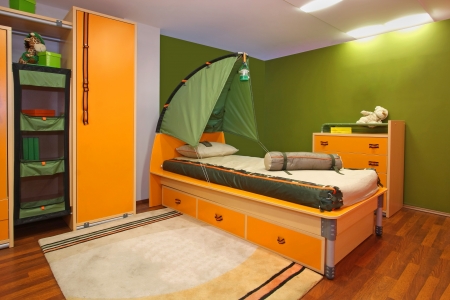 Green child bedroom interior with camping themeの写真素材