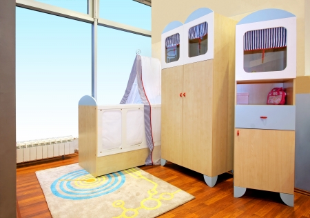 Modern nursery room interior with baby cribの写真素材