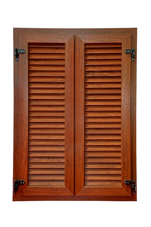 Retro window with closed brown wooden shuttersの写真素材