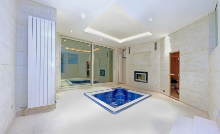 Blue hottub in the middle of large interiorの写真素材