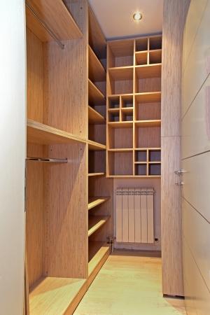 Empty walk in closet with wooden shelvesの写真素材