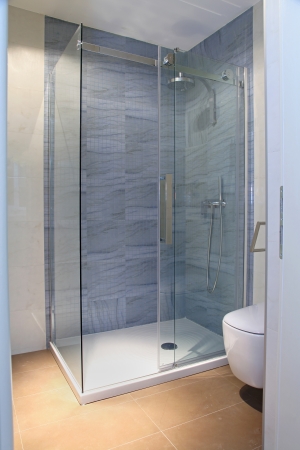 Modern shower with glass cabin inside bathroom interiorの写真素材