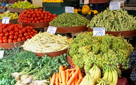 Fresh organic vegetables sold on market stallの写真素材