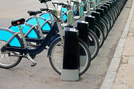 Bicycles parking rack on London street pavementの写真素材
