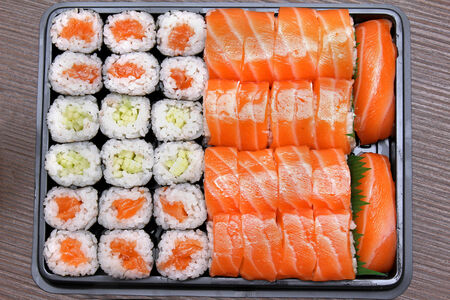 Freshly prepared takeaway sushi plate with salmon and tunaの写真素材