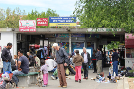 BELGRADE, SERBIA - MAY 10  Flea market where gypsies selling law quality goods  in Belgrade, Serbia, May 10, 2014; Outside of flea market entrance with many gypsies aroundのeditorial素材