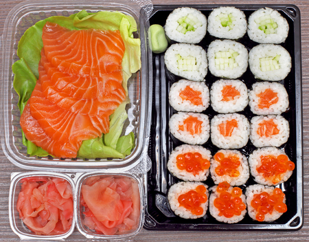 Sushi takeout plastic container with salmon and ginger の写真素材