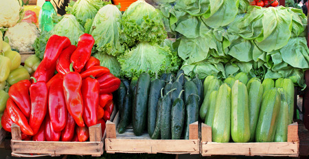 Wooden crates with fresh vegetables on market stallの写真素材