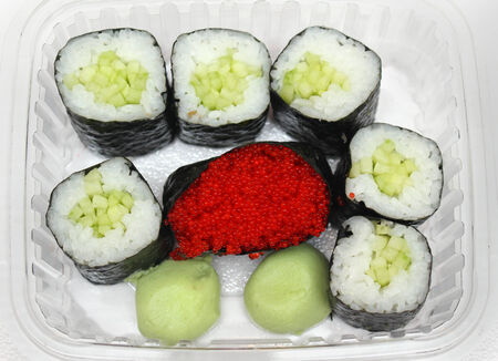 Freshly made sushi rolls with red caviar in middleの写真素材