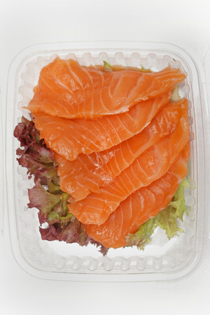 Fresh raw salmon fish in plastic boxの写真素材