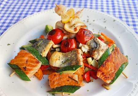 Seafood meal served on a white plateの写真素材