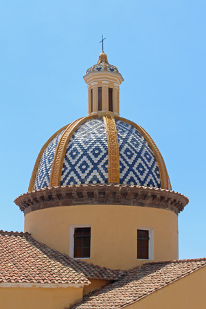 Old blue church dome with religious cross on topの写真素材