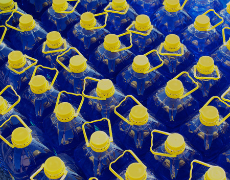 Blue antifreeze liquid glycol in plastic bottlesの写真素材