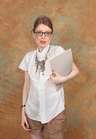 Young women preparing for business presentation with file in handの写真素材