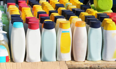 Different toiletries bottles on shelf outside on marketの写真素材