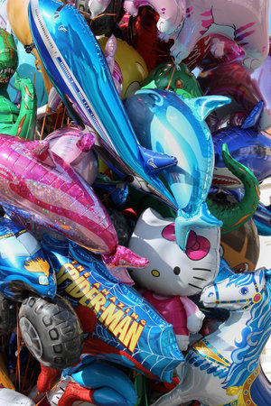 LJUBLJANA, SLOVENIA - OCTOBER 12, 2014: Big pile of colorful helium balloons with popular cartoon characters loved by kids and sold on public squares outsideのeditorial素材