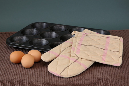 Baking tray oven mit and fresh eggs  prepared for making cupcakesの写真素材