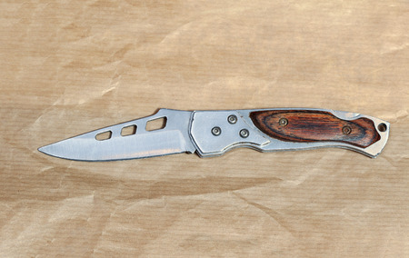 Small stainless steel pocket knife with wooden handleの写真素材