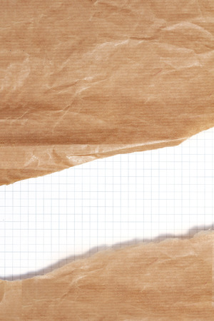 Brown paper background with cut off white part for cppy spaceの写真素材