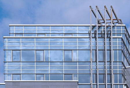 Modern building detail with blue glass facadeの写真素材