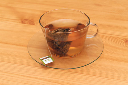 London, United Kingdom - January 11, 2015: Traditional British tea brand Twinings in transparent teacup on table during tea hourのeditorial素材