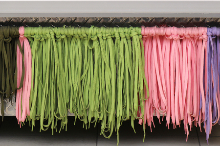 Fashion style colorful sneaker laces hanging from wall