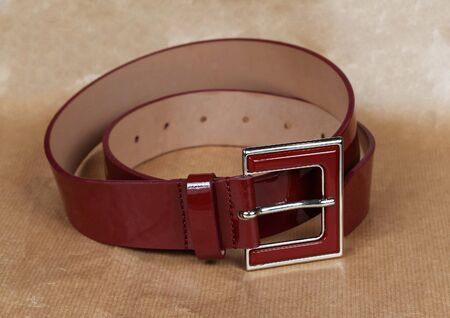 Shiny dark red patent leather belt accessoryの写真素材