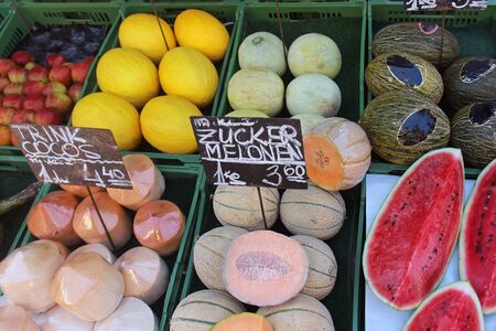 Fresh organic fruits piles on market stallの写真素材
