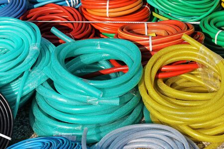 Plastic colorful gardening hoses sold on marketの写真素材