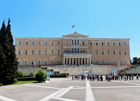 ATHENS, GREECE - May 04: Greek Parliament building overlooking Syntagma square in Athens, Greece - May 04, 2015; The Old Royal Palace which housed Greek Parliament since 1934 with tourists in frontのeditorial素材