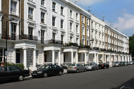 LONDON, UNITED KINGDOM - JULY 28: White houses with residential parking permit cars in Westminster London, UK - July 28, 2008; Residential street in Westminster council in London.のeditorial素材