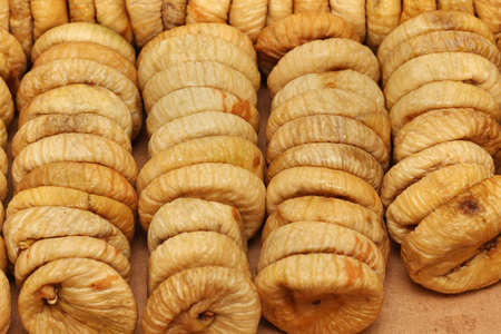 Organic fruit stack of brown dry figsの写真素材