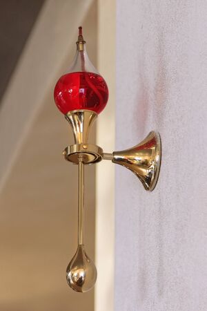 Decorative ancient wall oil lamp with gold details の写真素材