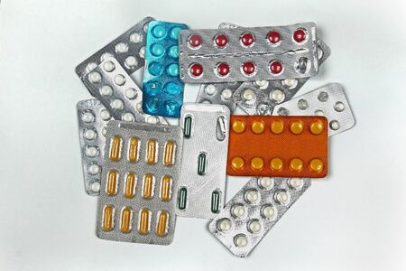 Large pile of medicine colorful pills blisters