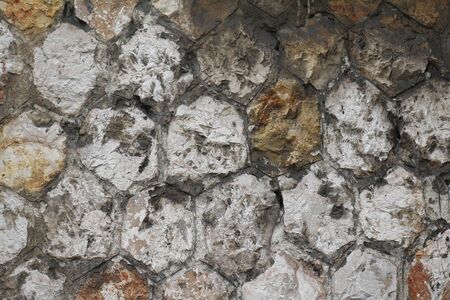 Dark dirty rocks stone wall texture patternの写真素材